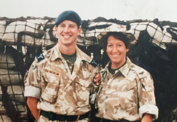 Colin and his mother in camouflage uniform