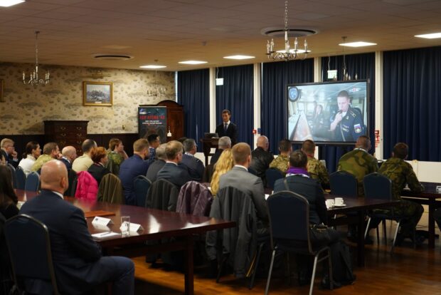 Wargame audience receiving a briefing