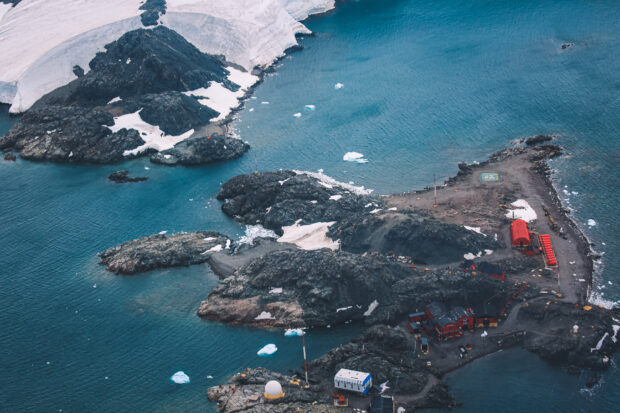 Aerial view of island with snow and buildings
